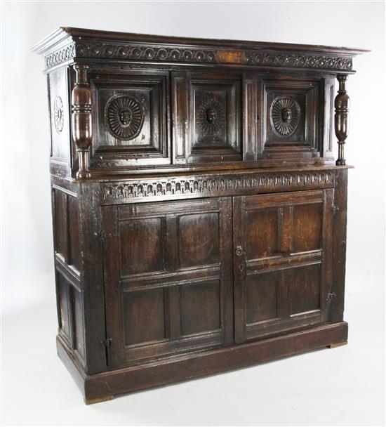 A 17th century carved oak court cupboard, W.5ft 4in.